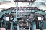 Early MD80 Cockpit – The major difference from the DC9 is the addition of a flight management system on the center glare shield. Since this airplane was designed by mechanical engineers, almost everything was operated by cables and pulleys.  Note the absence of a magnetic compass.  That was located behind the captain's head facing aft.  A series of mirrors were used to read it.